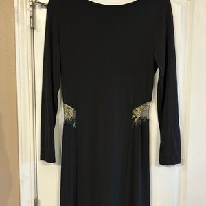 Long sleeves black fitted dress gold flower design that stop lower back